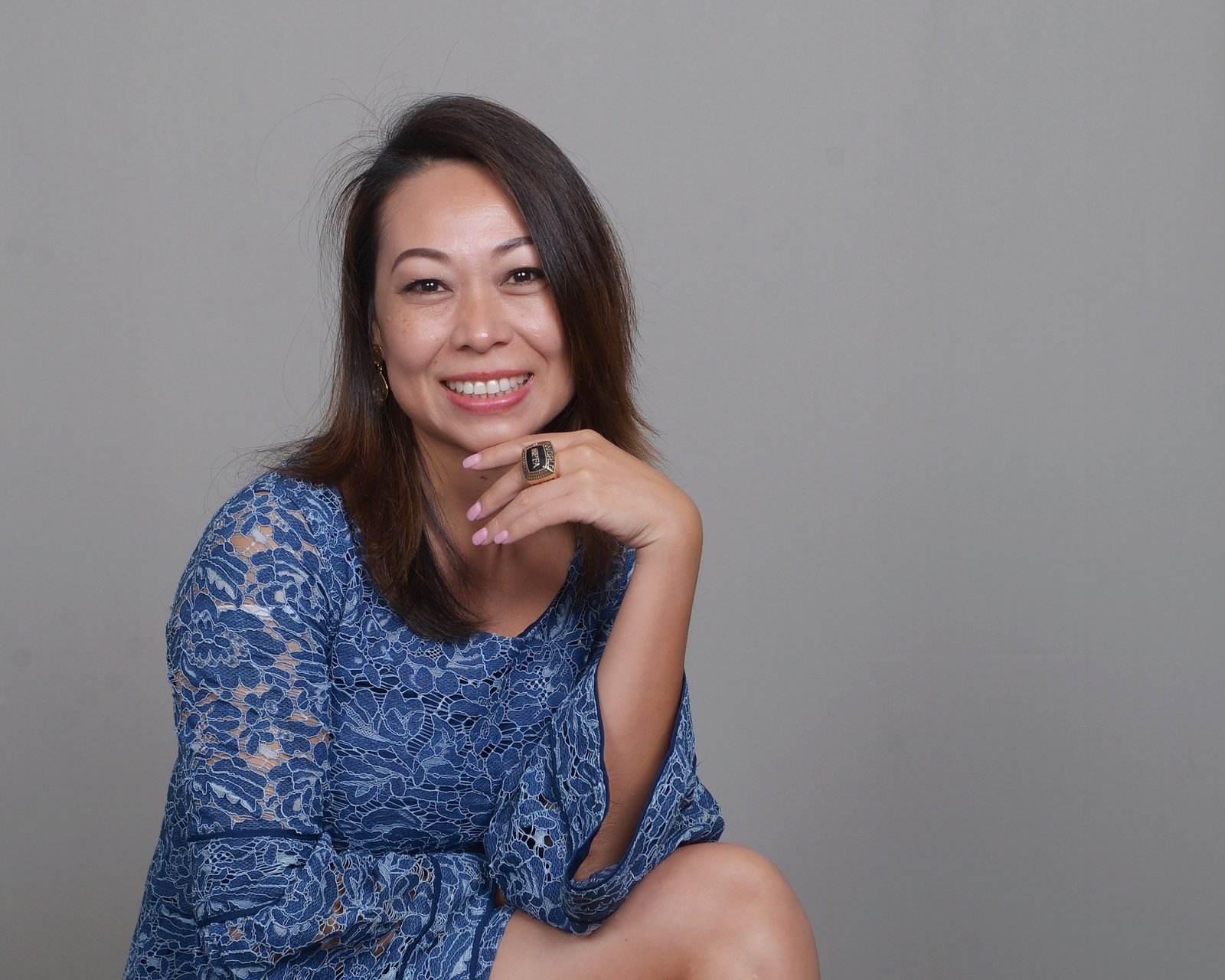 Hong Tu Vo smiling, wearing a blue dress